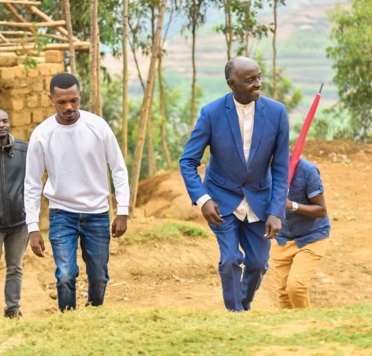 Walking to a community visit through the Rwandan hills